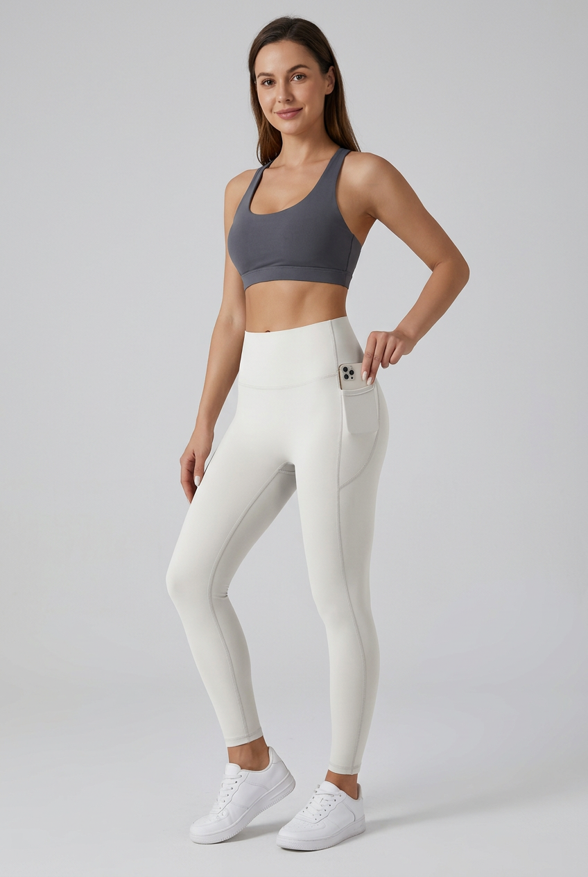 Full-body studio photo of ivory pocket leggings with the model’s face visible